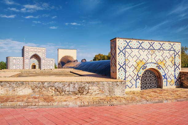 Samarkand Ulugbek Observatory - Samarquand Observatory - Ulugh Beg Mausoleum under blue summer sky. Built in the years from 1420 by the Astronomer Ulugh Beg, it is considered by scholars to have been one of the finest historic observatories in the Islamic world. Samarkand, Silk Road, Uzbekistan, Central Asia