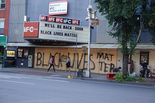 'Black Lives Matter' is painted on plywood that is boarding up the IFC Cinema in New York City's Greenwich Village.