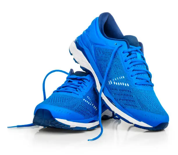 A pair of blue running shoes. 
Isolated on a white background.