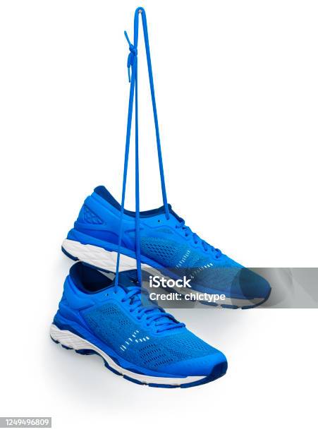 Running Shoes Hanging From A Hook Stock Photo - Download Image Now - Sports Shoe, Hanging, Shoe