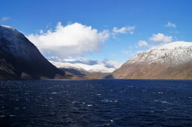snowcapped mountains shot from the water, Torngat Mountains