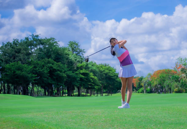 istock Woman golfer playing golf on the field 1249500156