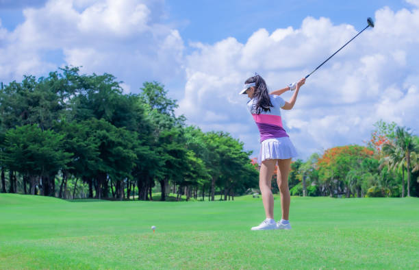 istock Woman golfer playing golf on the field 1249500160