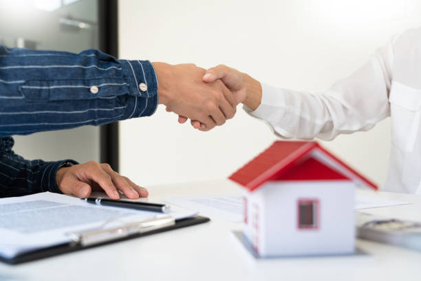 istock House developers and customer shaking hand after accept agreement finish buying or rental real estate for transfer right of property 1249500484