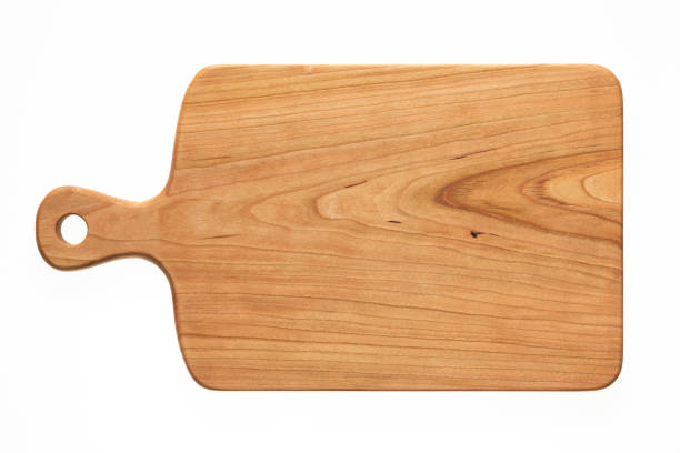 istock Handmade cherry wood chopping board. Cutting board isolated on white background 1249504426