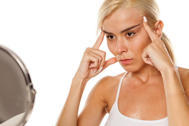 istock young woman tightening her face with her hands 1249506418