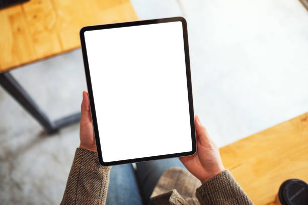 istock a woman holding black tablet pc with blank white desktop screen 1249507449