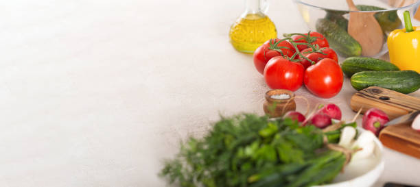 Ingredients for vegetable salad on kitchen table