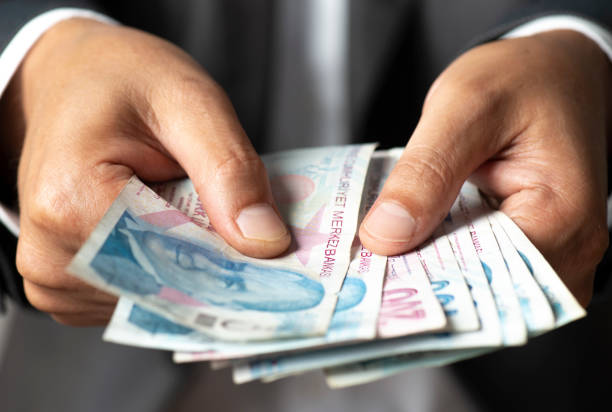 istock Man Giving Turkish Currency 1249510217