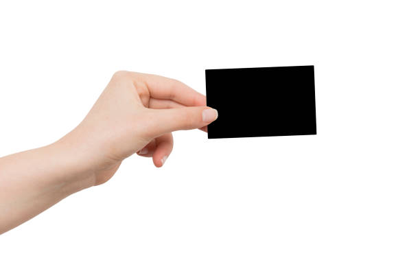 istock Hand Holding blank black card isolated on white background. (Clipping path) 1249510756