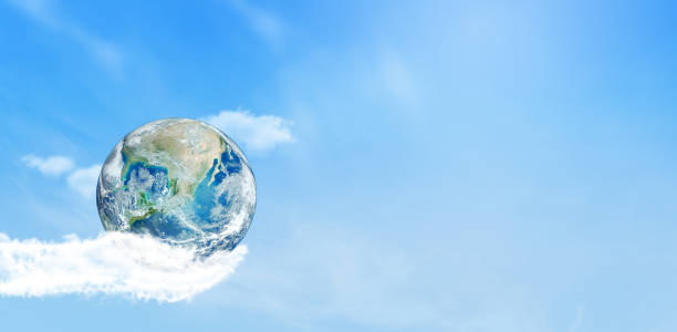 istock Blue planet earth in hand that made from tiny white clouds in blue sky. 1249510883