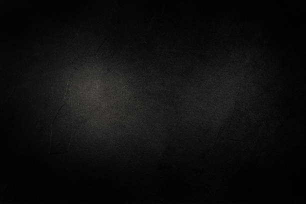 istock Studio dark room concrete wall grunge texture background with light shading. 1249511480