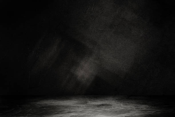 istock Studio dark room concrete floor grunge texture background with light shading. 1249511491