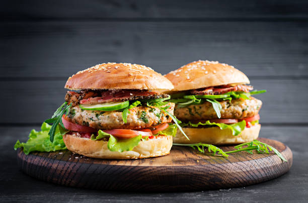 istock Big sandwich - hamburger burger with turkey meat,  tomato,  bacon and lettuce. 1249520540