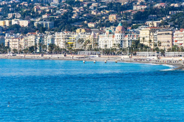 the promenade des anglais and the famous hotel negresco, nice, france - city of nice france beach panoramic imagens e fotografias de stock