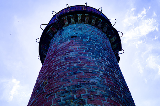 The lookout tower is located in the Palatinate Forest in Germany. He stands on a small mountain in the middle of the forest.