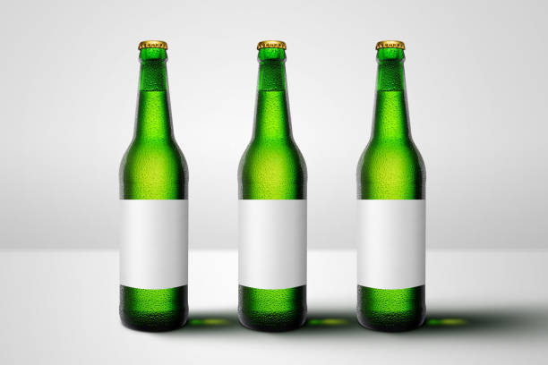 istock Green beer bottles with blank label mock-up advertising 1249525174