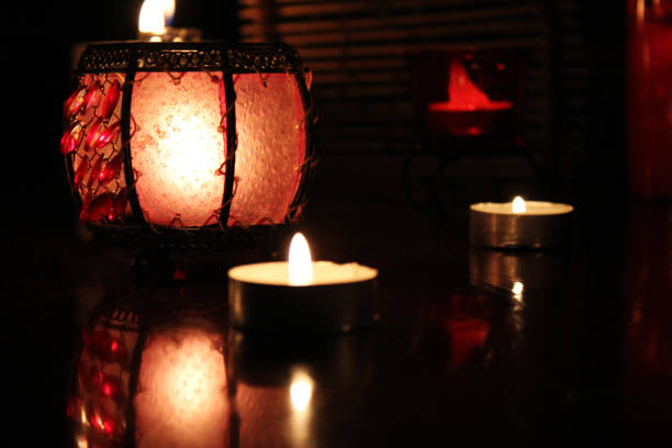 istock Red candle lights on the dark background, romantic scenery 1249527309