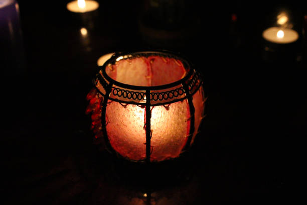 istock Red candle lights on the dark background, romantic scenery 1249527445