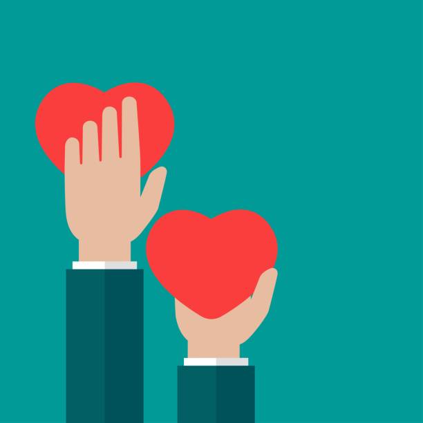 istock Hands holding red heart on blue background. charity, philanthropy, support, giving 1249528690