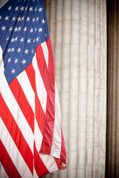 American flag and Wall Street columns - Stock image