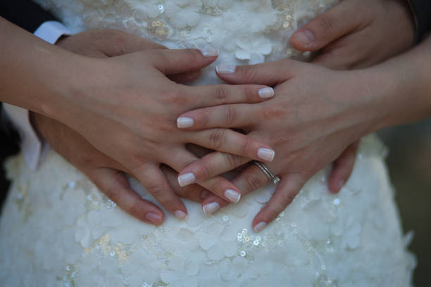 istock Elegant bride and groom embracing and posing 1249532359