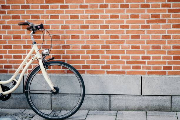 istock Vintage bicycle on the brick wall background 1249534101