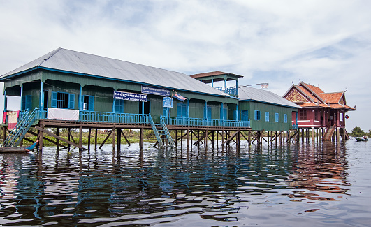 Kampong Phluk, Cambodia - December 4, 2011:  Town school and Fishery Office built on stilts in the Tonle Sap lake of Cambodia.