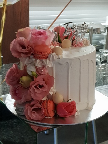 Rose gold chocolate cake with macaroons