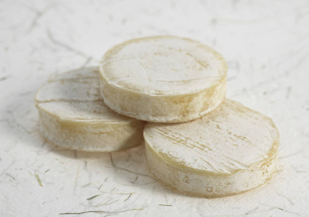 istock ROCAMADOUR, FRENCH GOAT CHEESE AGAINST WHITE BACKGROUND 1249541355