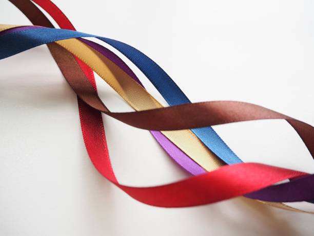 Colorful curled ribbons on white background
