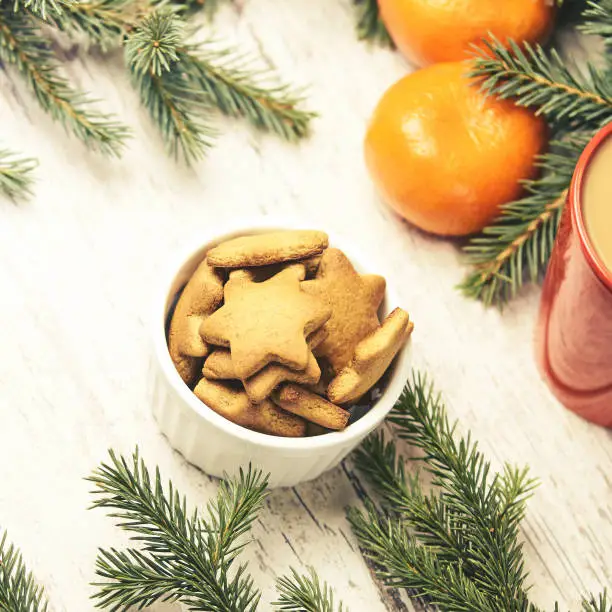Gingerbread Cookie. Cup of coffee. Tangerines. New Year mood.