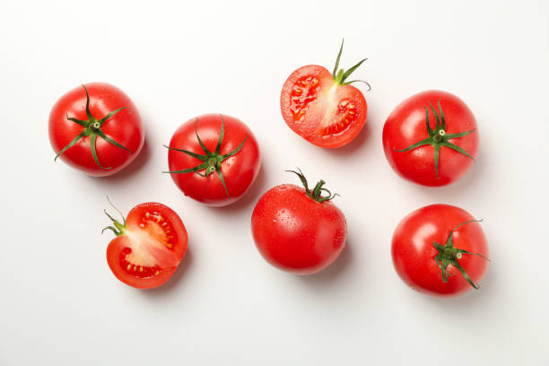 istock Fresh ripe tomatoes on white background, top view 1249547427