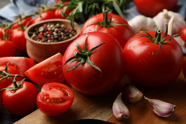 istock Composition with tomatoes on wooden background. Ripe vegetable 1249547735