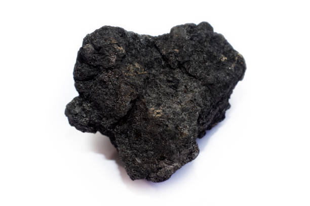istock A piece of black coal from the mine on a light background. 1249549018