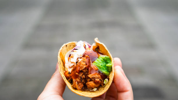istock Mexican traditional authentic homemade tacos with pulled pork beef chili con carne serve with tomato salad and avocado guacamole and dip sauce 1249552522