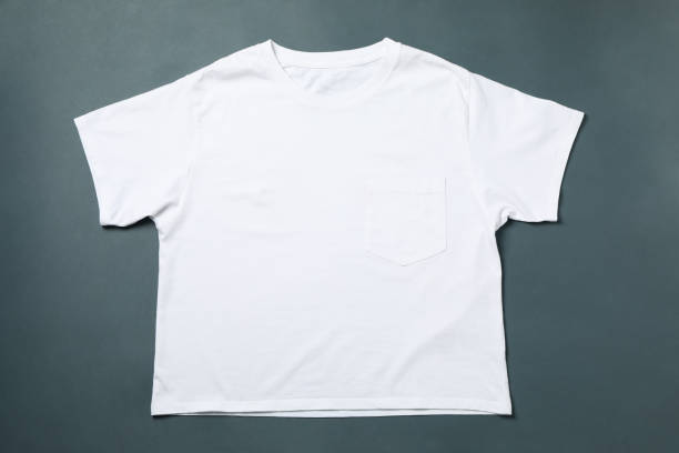 istock Blank white t-shirt on light black background, space for text 1249555217