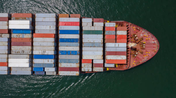 istock Container ship in import export global business worldwide logistic and transportation, Container ship unloading freight shipment, Aerial view container cargo boat freight ship. 1249555487