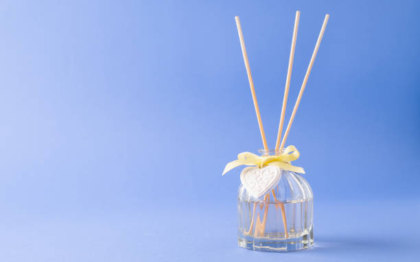 istock Aromatherapy concept. Aroma diffuser. Incense sticks. Thing to make good scent at home. Blue background with copy space 1249556929