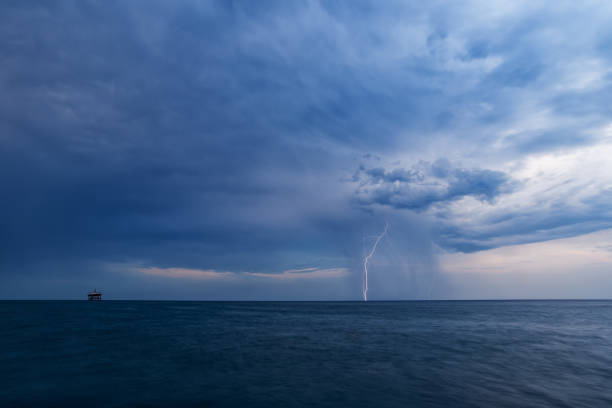 istock Daytime lightning with rain and dark clouds over the Black sea 1249558284