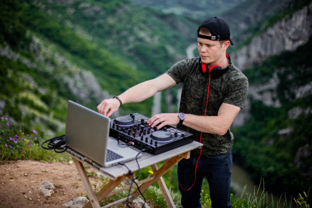 istock Dj playing music in nature 1249560957