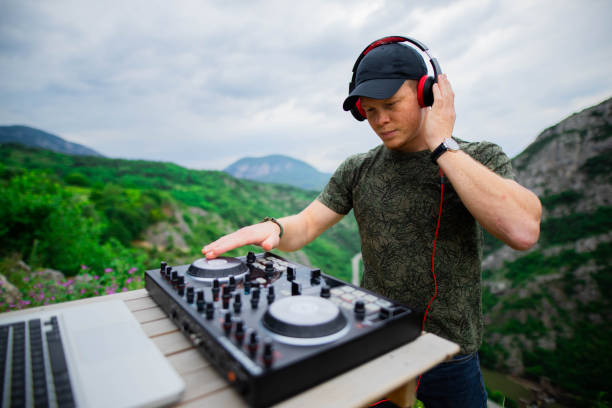 istock Dj playing music in nature 1249560968