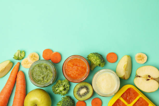 istock Composition with baby food on mint background, top view 1249562444