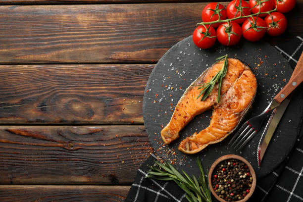 istock Composition with tasty grilled salmon on wooden background, top view 1249563241