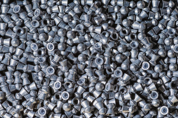 istock Grey lead bullets for air rifle background 1249568047