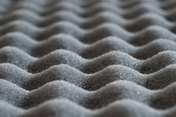 istock Abstract wavy texture of grey sound-proof acoustic foam, selective focus 1249568095