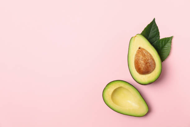 istock Ripe fresh avocado on pink background, top view 1249571976
