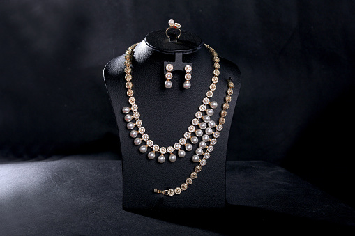 beautiful pearl necklaces photography with black background