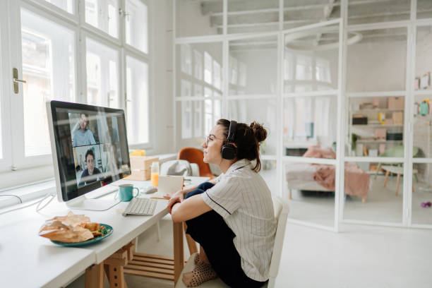 istock Young woman having a video call with her friends 1249572068