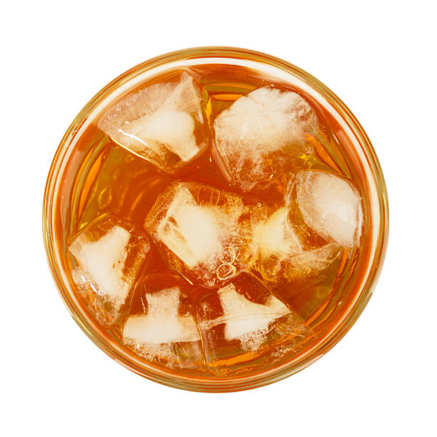 istock Glass of iced tea isolated on white 1249572136